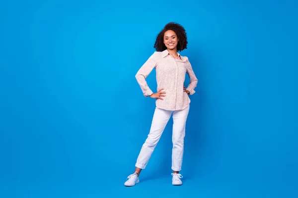 stock image Full length portrait of pretty cheerful person put hands waist posing isolated on blue color background.