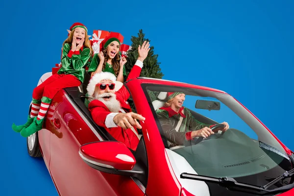 Photo Excited Cheerful Santa Claus Helpers Wear Costumes Riding Vehicle — Stock Photo, Image
