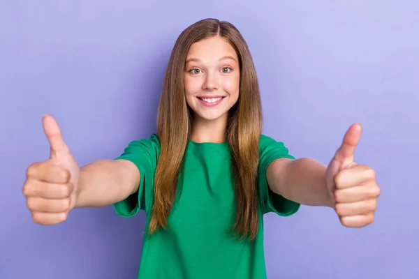 Photo of glad joyful lady wear green trendy clothes demonstrating arms thumbs up good nice job isolated on purple color background.