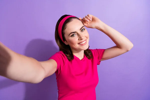 Photo of positive sporty lady share live stream enjoy hobby time fitness outdoors isolated on purple color background.
