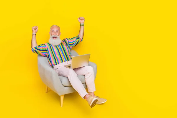 Full Length Photo Overjoyed Positive Person Sit Armchair Raise Fists — Stockfoto