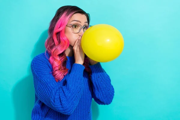 Photo Young Funny Girl Blowing Yellow Air Balloon Wear Blue — Stok fotoğraf