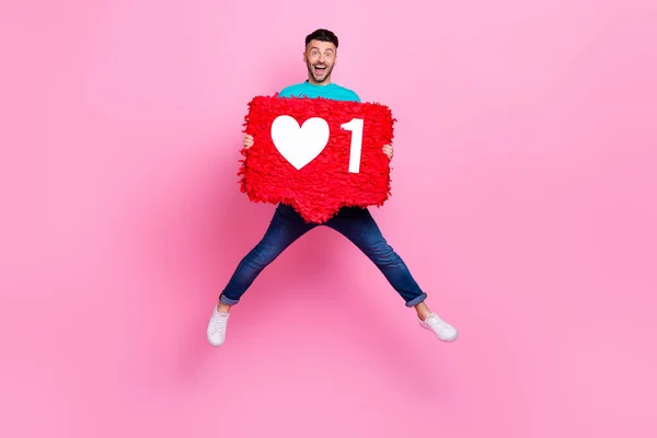 Full Size Photo Young Nice Guy Jump Holding Heart Icon —  Fotos de Stock