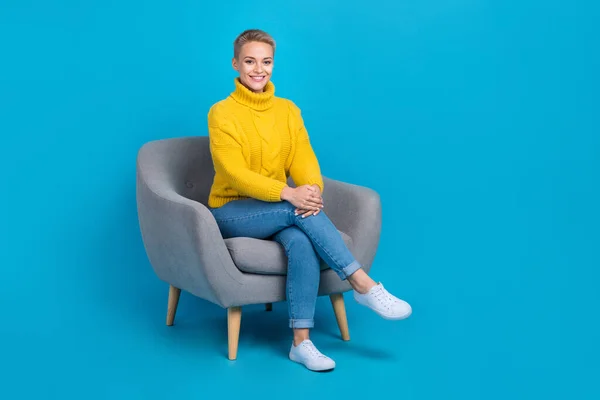 Full length photo of stunning adorable lady wear trendy clothes sitting office room take interview isolated on blue color background.