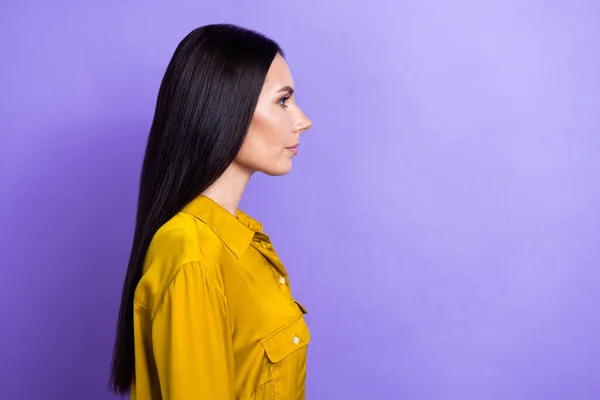 Profile portrait of focused serious lady look empty space information isolated on purple color background.