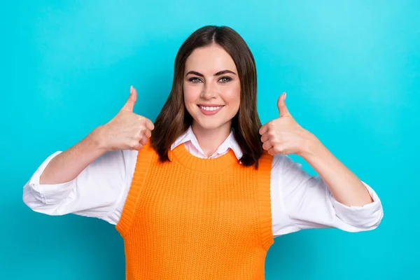 Portrait of gorgeous optimistic girl with straight hairdo wear white shirt thumbs up nice job isolated on turquoise color background.