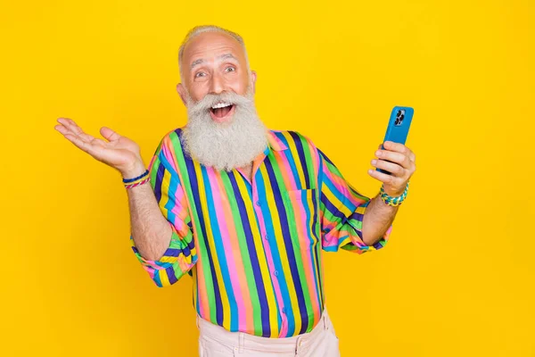 Photo Crazy Overjoyed Impressed Man Hold Telephone Isolated Yellow Color — Photo