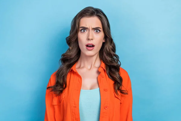 stock image Photo of young attractive brunette curly hair lady speechless unexpected reaction bad news global poverty problem isolated on blue color background.