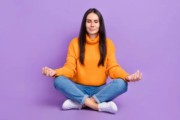 Full length photo of gorgeous lady wear comfort clothes sitting floor rest relax isolated on purple color background.