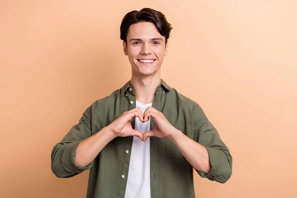 Photo Young Positive Student Guy Donator Showing Fingers Love Symbol — Stockfoto