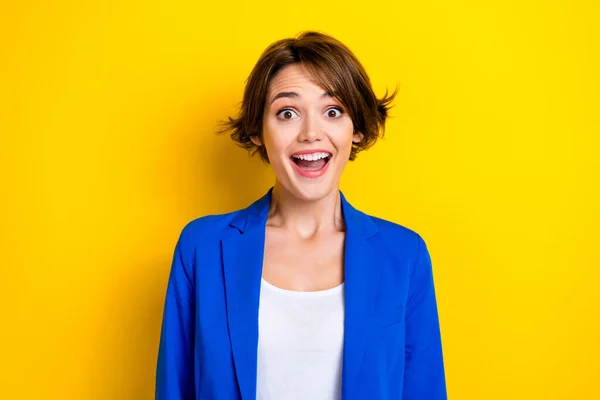 Portrait photo of excited funny woman open mouth surprised business company owner reaction good unexpected profit isolated on yellow color background.