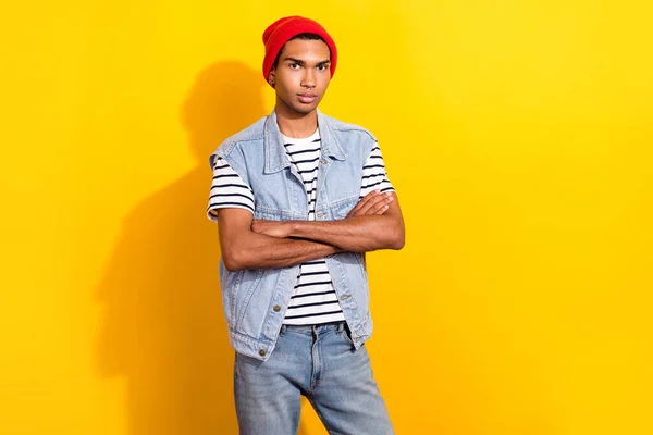 Photo of successful man nice outfit stand near empty space promoting new clothes collection isolated on yellow color background.