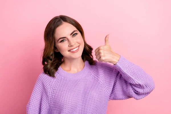 Photo of lovely cute positive lady wear warm stylish pullover demonstrate thumb up yes agreement isolated on pink color background.