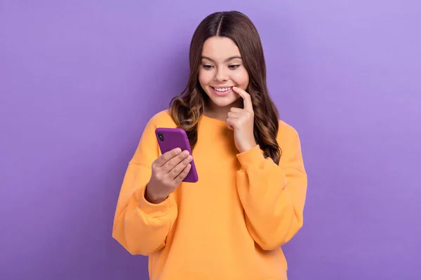 Photo of cute lovely lady blogger read instagram twitter post share repost enjoy quality device isolated on purple color background.