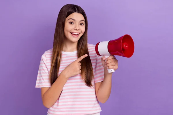 Photo of funky excited lady wear striped white t-shirt pointing finger bullhorn isolated violet color background.