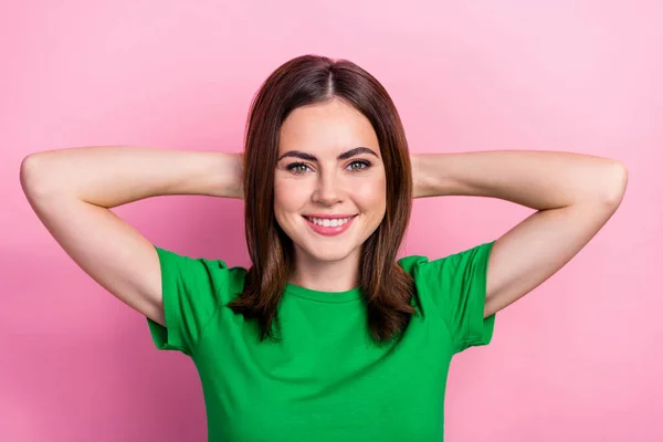 Photo of adorable satisfied person beaming smile arms behind head isolated on pink color background.