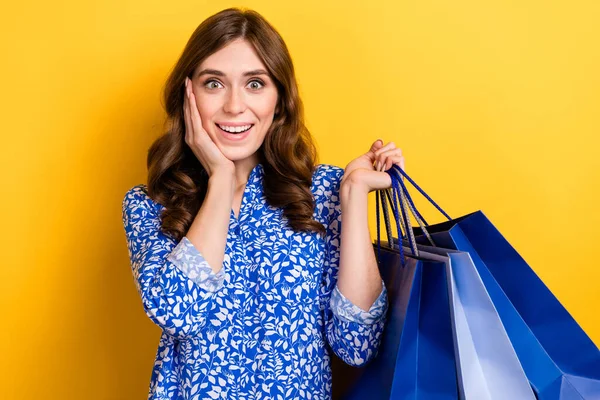Photo of astonished lovely lady wear blue trendy clothes special offer nice proposition isolated on yellow color background.
