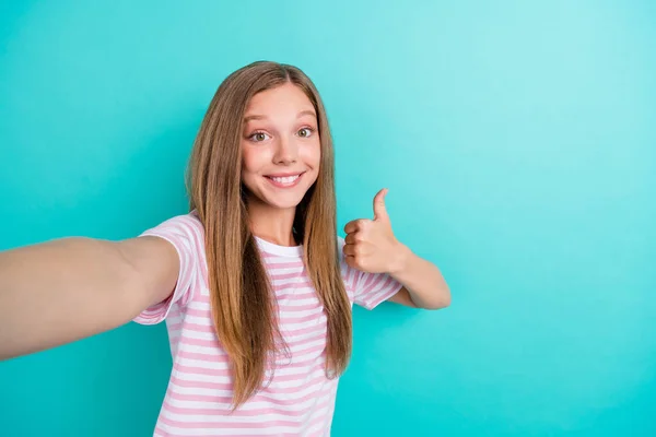 Photo of adorable satisfied person toothy smile take selfie show thumb up isolated on aquamarine color background.