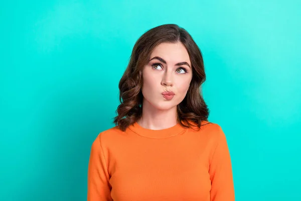 Photo of young charming minded adorable lady wear trendy top pouted lips coquette look empty space idea isolated on aquamarine color background.