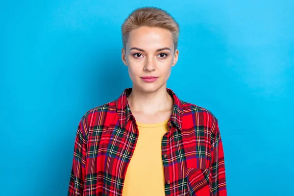 Portrait of confident college student lady smart casual outfit wear plaid shirt serious face freelancer job worker isolated on blue color background.