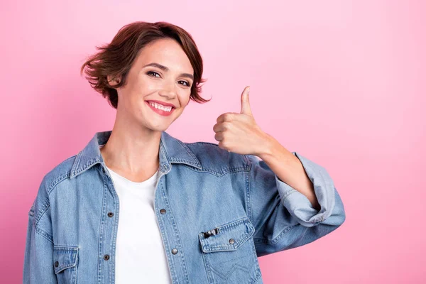 Closeup portrait of positive adorable girl bob brown hair thumb up recommendation new vacancy job opening isolated on pastel pink color background.