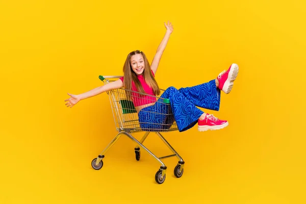 Photo of cheerful crazy lady wear trendy clothes open arm good mood want hug you rejoice sale discount isolated on yellow color background.