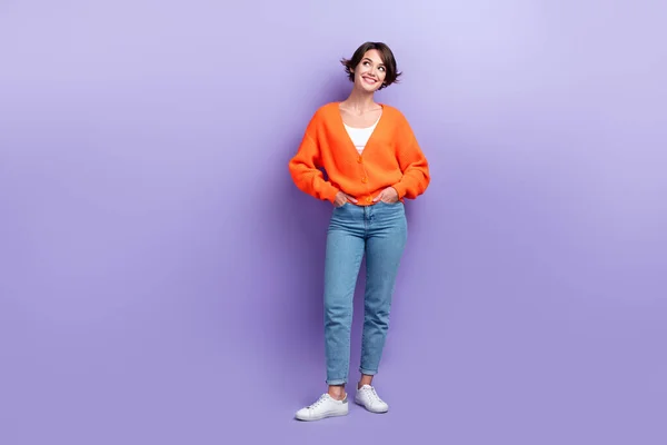 Full length photo of young dreaming minded attractive cute woman wear trendy casual outfit new brand clothes isolated on purple color background.