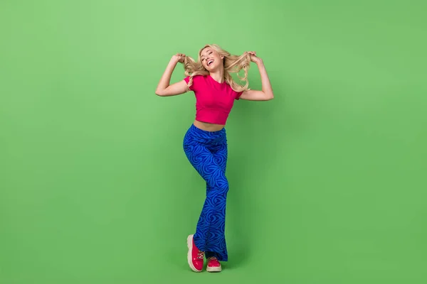stock image Full length photo of funny sweet woman wear pink top having fun dancing isolated green color background.