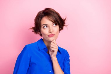 Closeup photo portrait of young deep thinking entrepreneur girl touch chin looking empty space advertisement isolated on pink color background. clipart