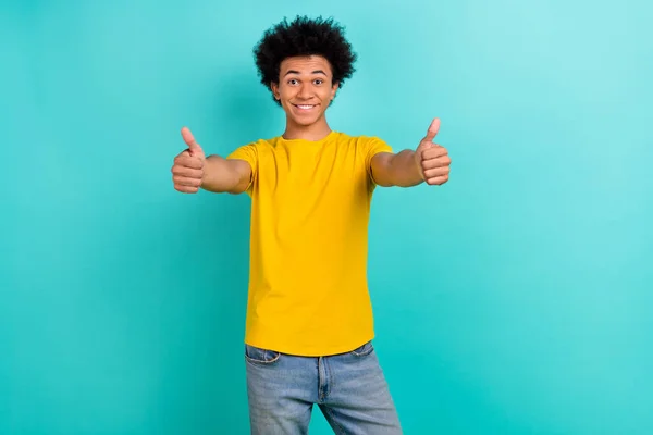 Photo of positive excited person arms fingers demonstrate thumb up isolated on teal color background.