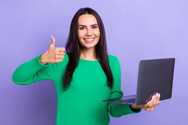 Portrait advert of young latin lady it specialist intern after academy prepare web designers thumb up hold laptop isolated on purple color background.
