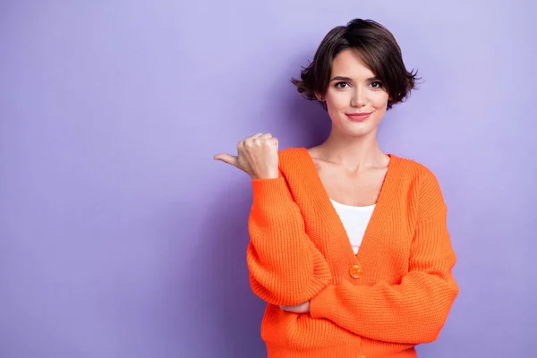 stock image Photo of funky confident woman wear orange cardigan showing thumb empty space isolated violet color background.