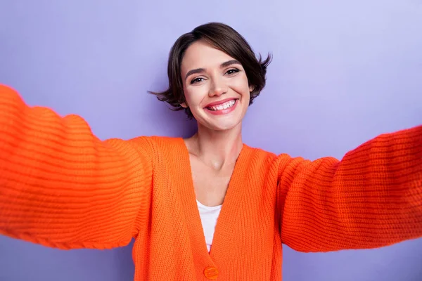Photo of gorgeous joyful lady influencer wear bright clothes recording story instagram twitter post isolated on purple color background.