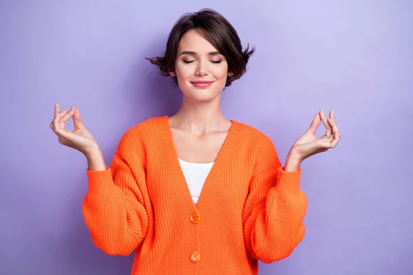 Photo of lovely pretty adorable lady wear orange comfort clothes enjoy yoga time isolated on purple color background.