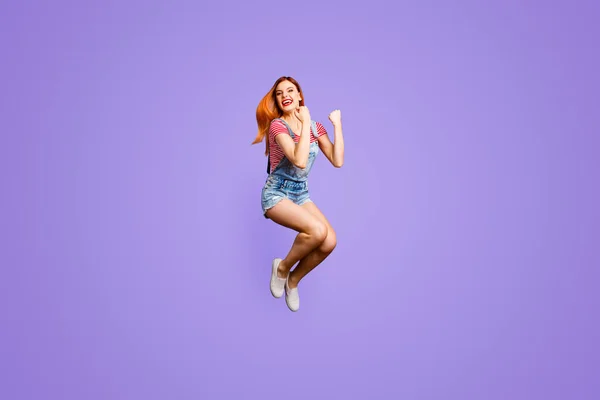 Dreams come true exams are passed done finished Full length size body studio photo portrait of cheerful joyful cool girl gesturing with hands jumping up isolated bright vivid background.