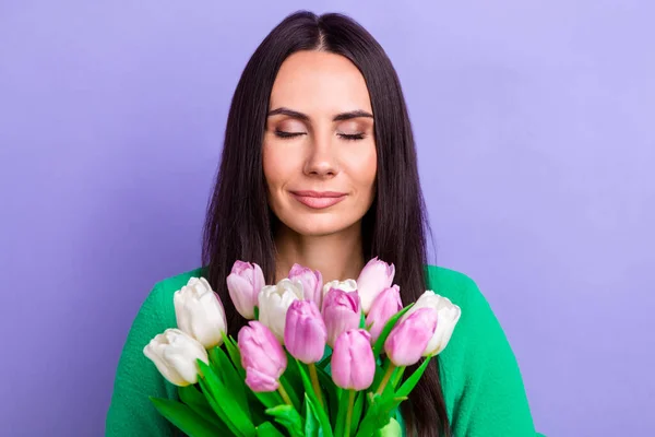 Photo of adorable young latin appearance beauty woman hold tulip flowers enjoy flavor eyes closed isolated lilac color background.