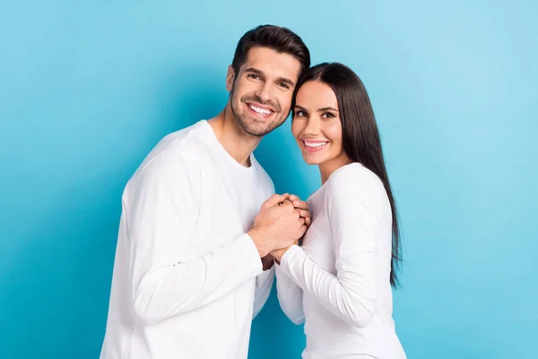 stock image Profile photo of two positive cheerful partners hold arms toothy smile isolated on blue color background.