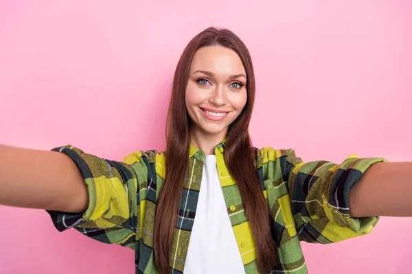 Closeup selfie photo of smile pretty young woman recording her blog satisfied have fun wear yellow jacket shooting isolated on pink color background.