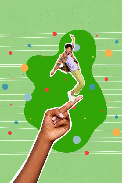 Vertical collage portrait of big arm finger hold mini excited guy dancing isolated on drawing green background.