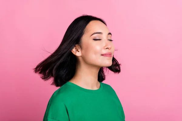 Profile photo of cute gorgeous person closed eyes flying hair isolated on pink color background.
