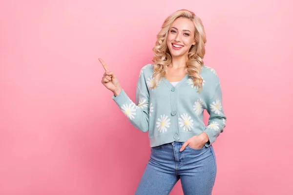 Photo of funny young girl blonde curly hair wear stylish outfit point finger empty space new model agency isolated on pink color background.