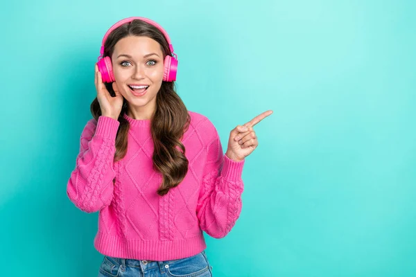 Portrait of cheerful excited lady wear trendy pink clothes recommend quality device sale empty space isolated on cyan color background.