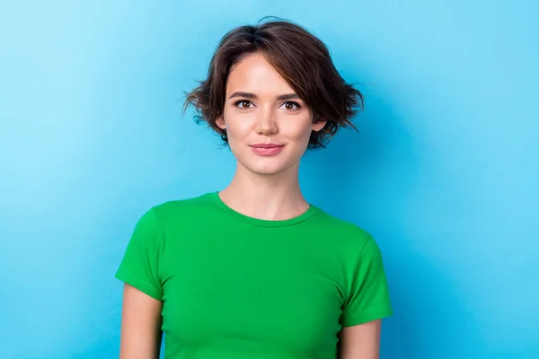 Photo of charming good mood lady dressed green top smiling isolated blue color background.