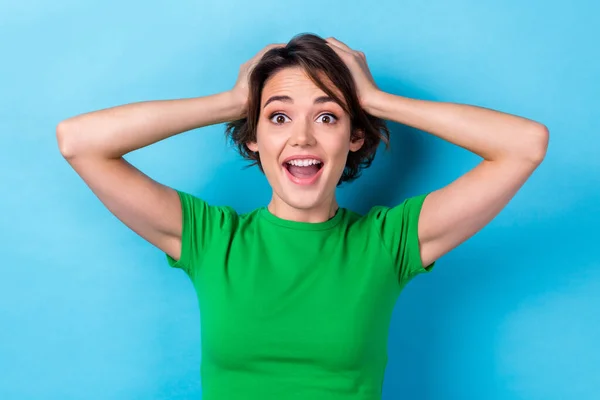 stock image Portrait of young confused girl hands head unexpected shopping day promo black friday advertisement isolated on aquamarine color background.