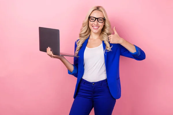 stock image Photo of young good mood promoter working it specialist girl blonde wavy hair wear blue suit thumb up ecommerce isolated on pink color background.