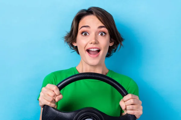 Closeup photo of young excited emotion girl young age rent automobile insurance fast speed steering wheel isolated on aquamarine color background.