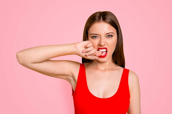Disagreement pain lifestyle facial emotion expressing concept. Cropped close up photo portrait of beautiful gorgeous stunning nice lady holding forefinger near mouth isolated on vivid background.