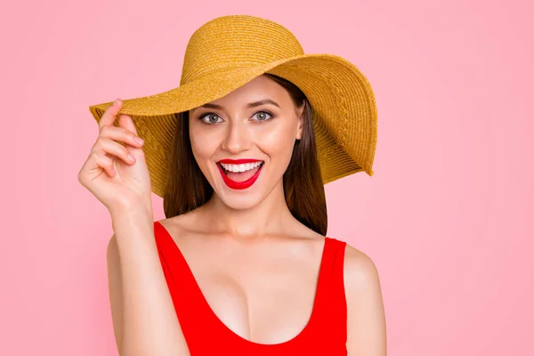 stock image Closeup photo portrait of cheerful cool joyful excited amazed astonished beautiful girl with stylish make-up touching wide brim on trendy hat laughing at camera isolated vivid background.