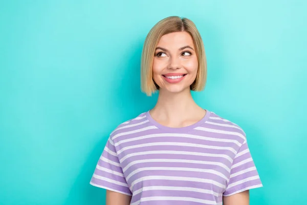 Photo of nice gorgeous person with straight hairstyle dressed trendy t-shirt look empty space isolated on turquoise color background.