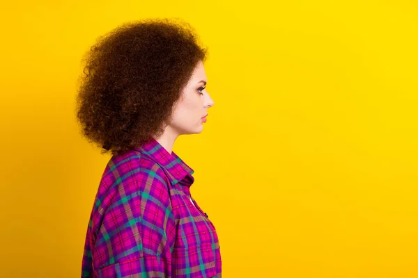 Photo of sweet charming lady wear checkered jacket looking empty space isolated yellow color background.